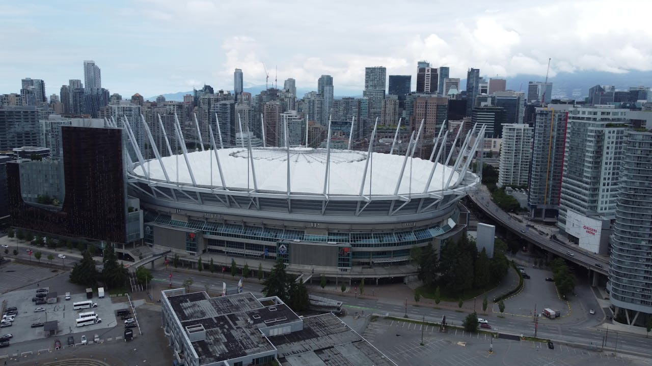 about-us-02 Captured from above, this image showcases BC Place Stadium against the Vancouver skyline.